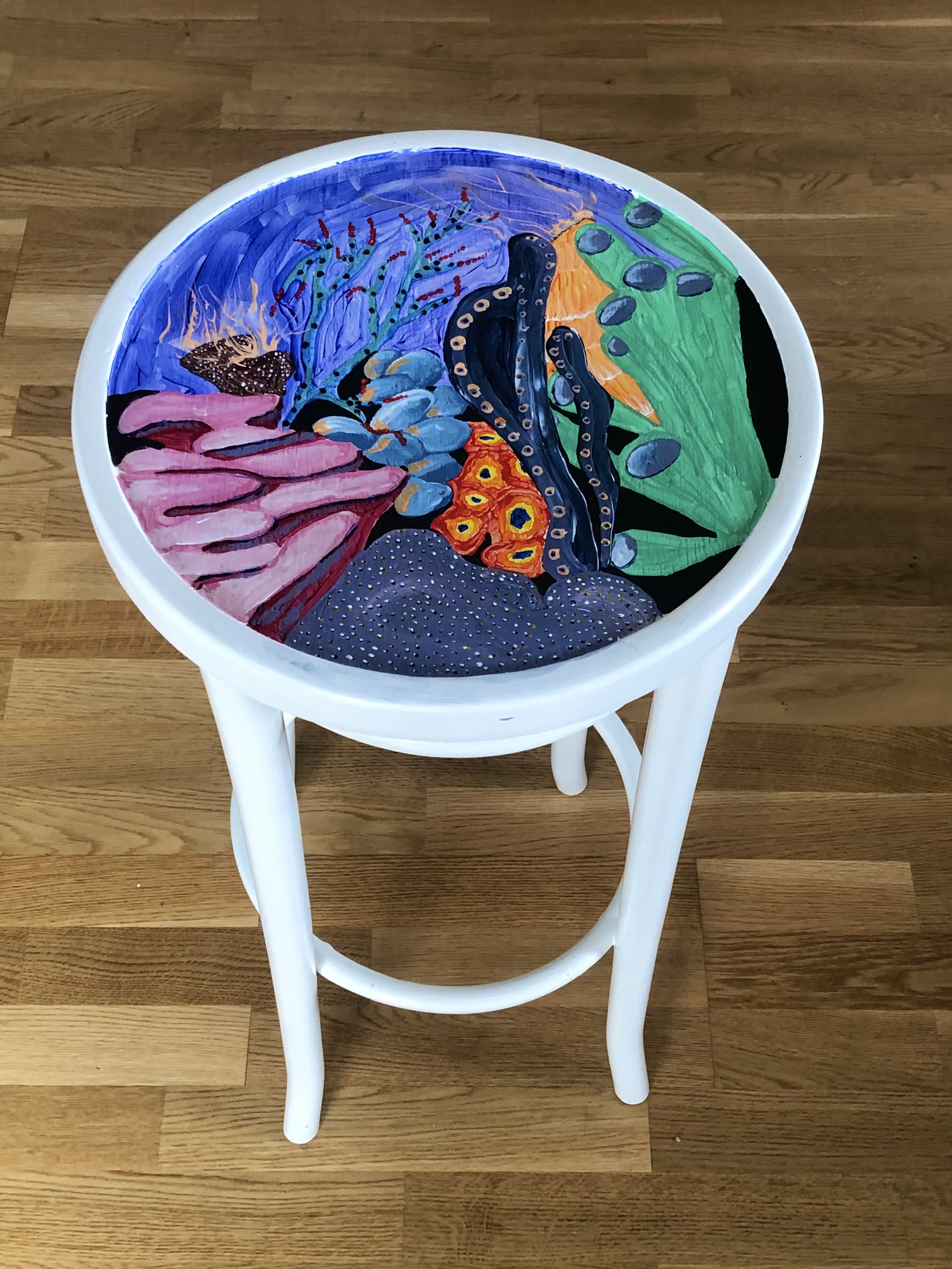 white stool with underwater scene painted on top of it